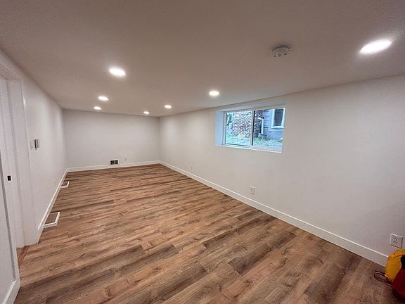 Spacious living room with beautiful natural light.