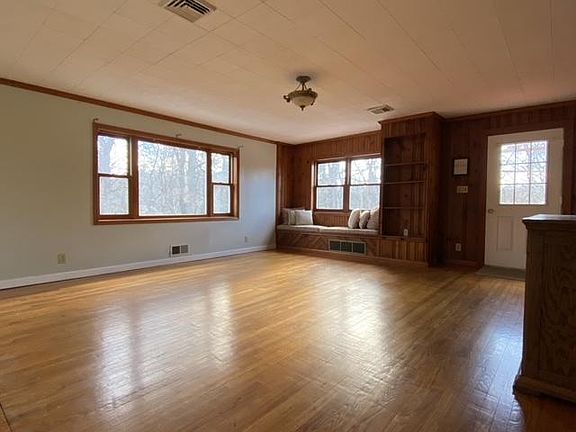 Large sun filled living area with direct access to deck
