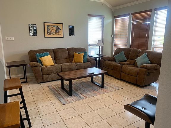Open living area with reclining couches.