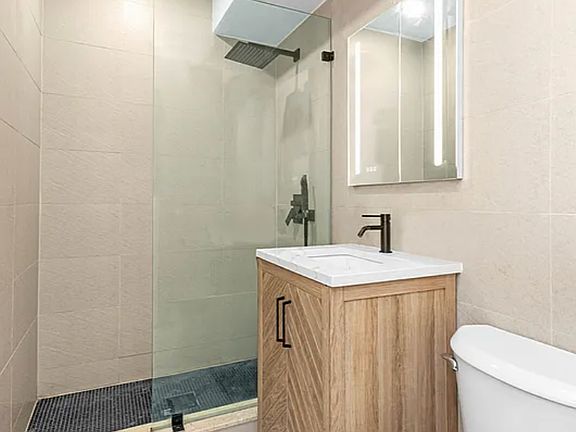 5th image of 228 E 25th St APT 6