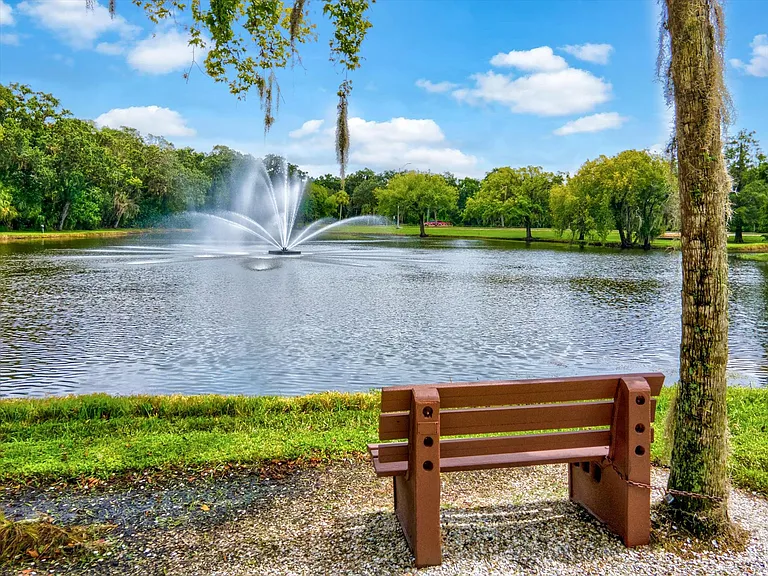 one of many benches and ponds to enjoy within The Meadows.