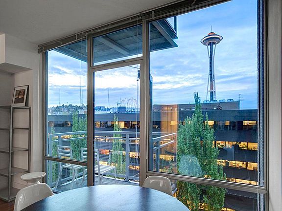 Floor to ceiling window with spectacular view of the Space Needle. Private balcony.