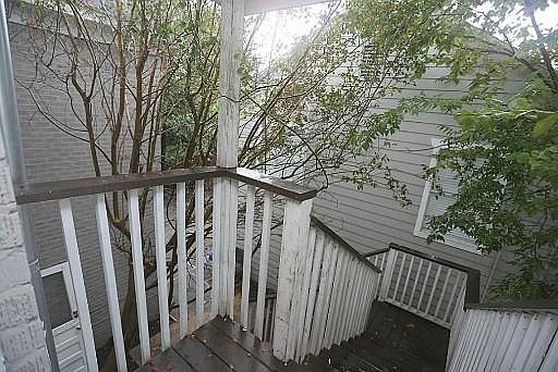 Back door to garage and fenced patio area