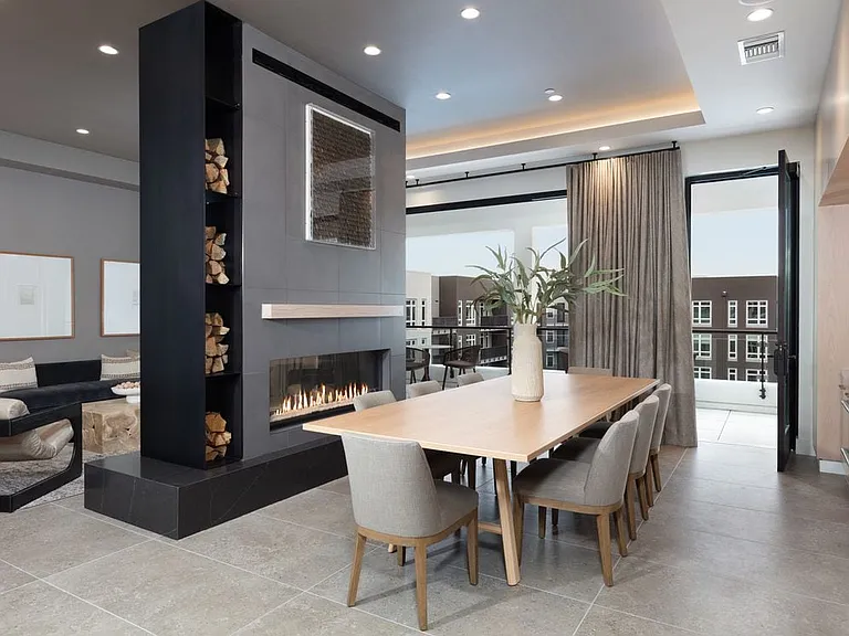 5th Floor Hosting room with seating, fireplace, and entertaining kitchen