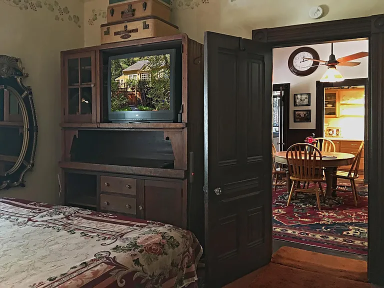 Bedroom showing entrance to large, unique dining room.