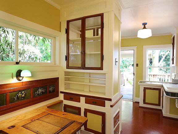 Kitchen with built-ins including folding table for two.