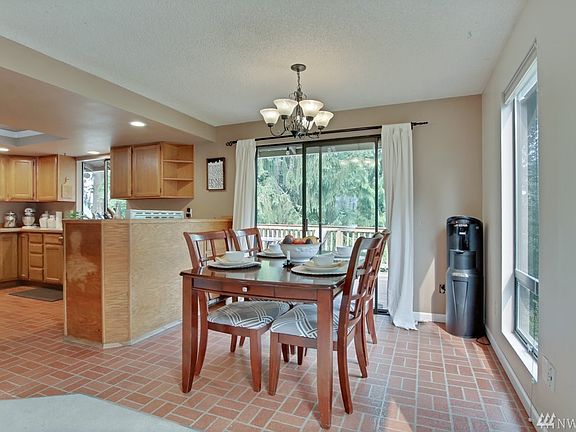 Dining room with access to large entertainment sized deck.