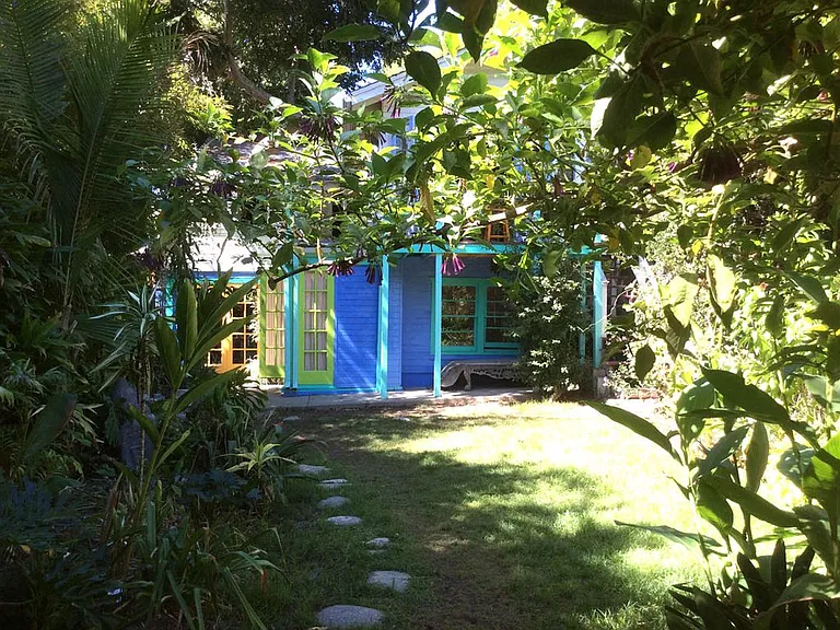 Back of house. Shared garden. Huge with many places to sit.