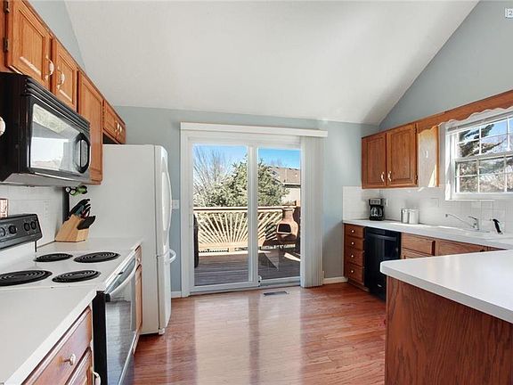The Kitchen has a newer dishwasher plus an abundance of cabinets and counter top space.  Through the sliding glass door you enter the beautiful deck overlooking the back yard.