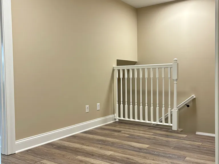 sitting area at top of stairs on 2nd floor with phone & cable hook up