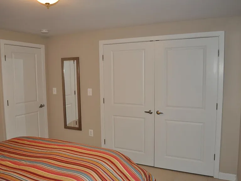 basement bedroom with walk-in closet