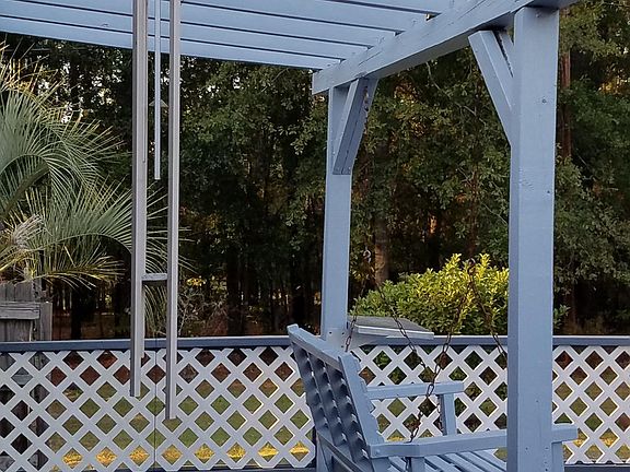 swing and pergola on back deck