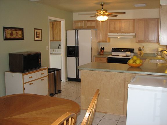 View of kitchen and inside laundry room