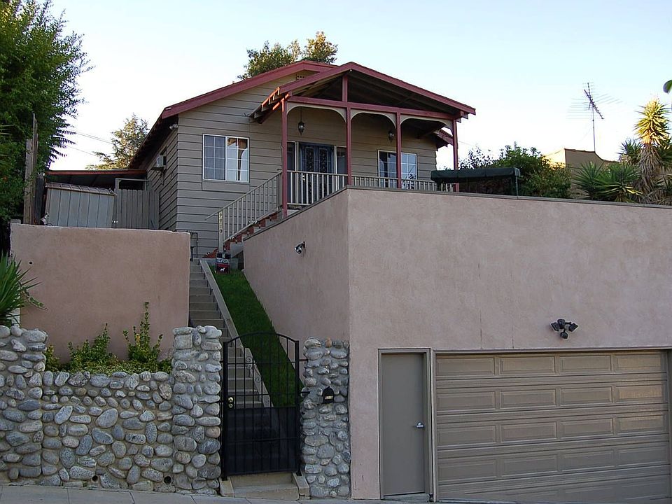full front- arroyo river rock wall