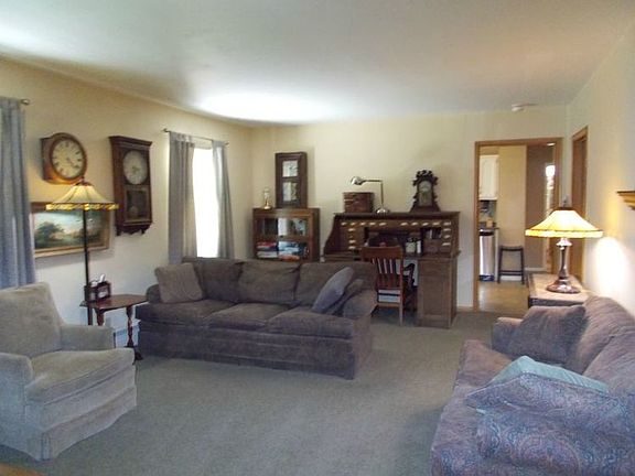 Living room area is extra large, with three windows.