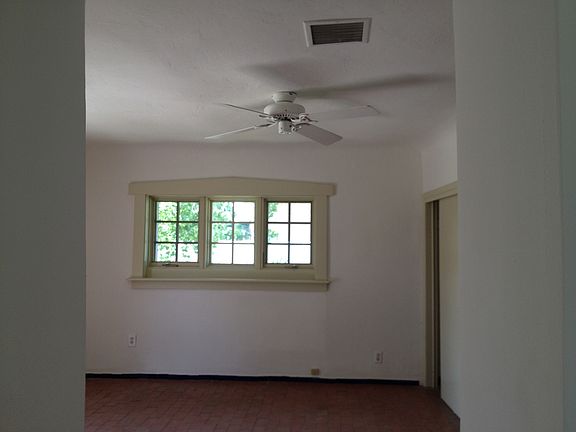 Living room window with fan.