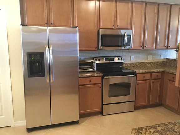 Kitchen has a pantry and room for a small dining table.