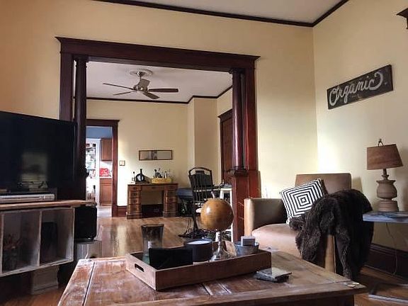 Living Room - higher than average ceilings and original columns.