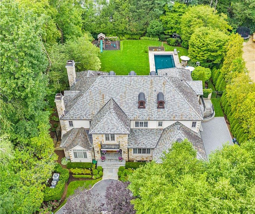 Stone and stucco colonial built in 2009 on over half acre with pool in the heart of Fox Meadow!