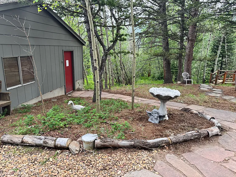 Flagstone walkway near garage