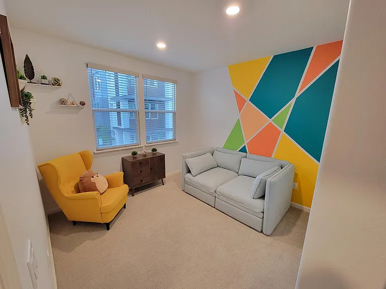 Second bedroom with beautiful accent wall.