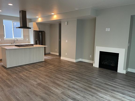 View of the open floorplan on level II with a fireplace!