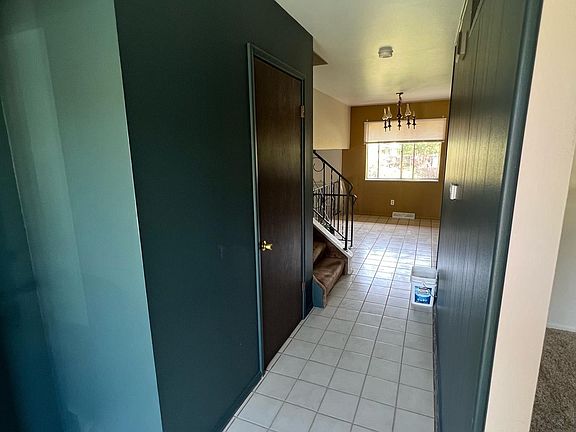 Entryway with coat closet.