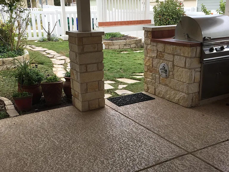 Charming Pergola with Stone Pathway Next to Outdoor Kitchen