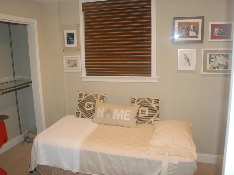 Bedroom with closet / office combo. HP color networked printer.