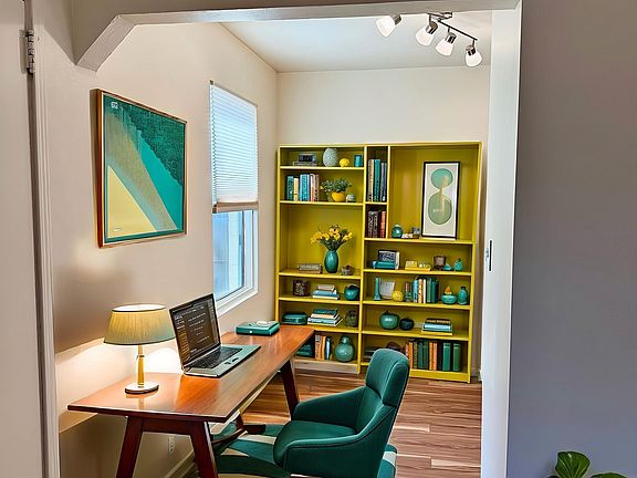 Cove area is perfect for a desk. View out the window is quite charming.