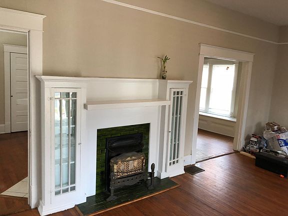 You'll be greeted by original fireplace,and giant trim of this historic gem.