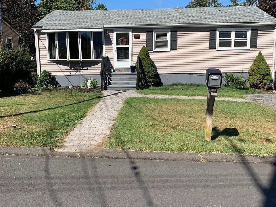 Front of house with double drive way