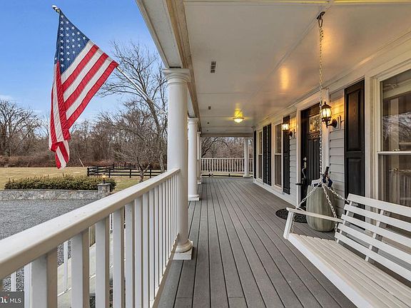 HUGE 60' wrap around porch with swing