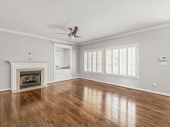 Large living room. pre-wired for TV above the mantle, display shelf.