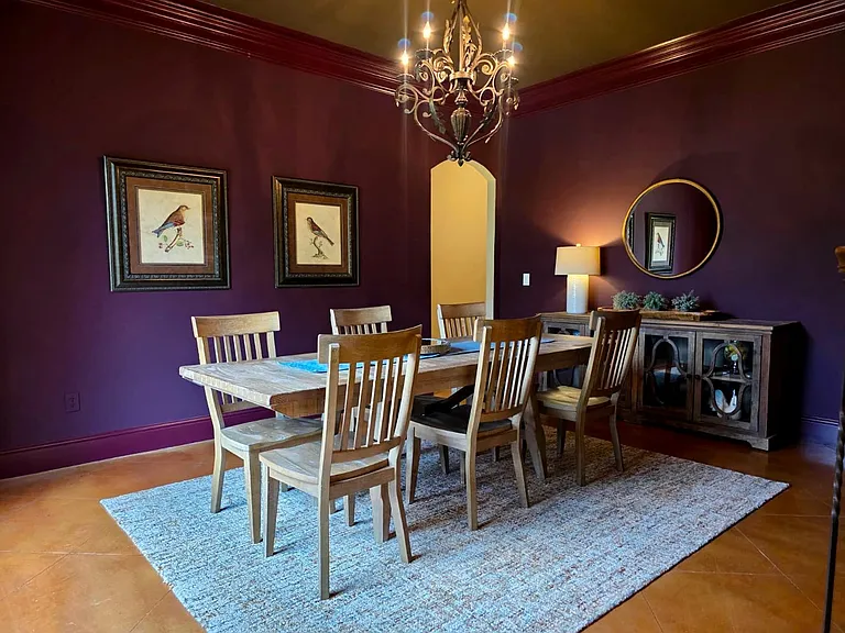 Dramatic dining room with views of pond