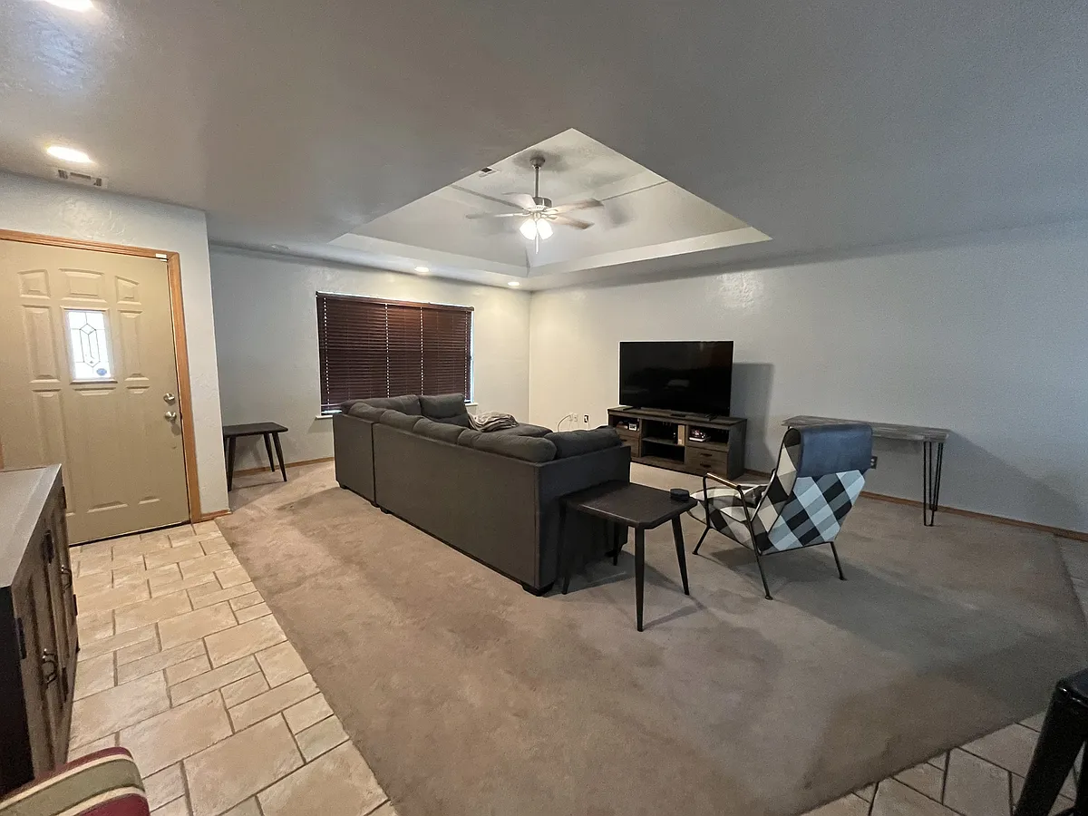 Living room open to kitchen and entryway - 2117 N Burdick St