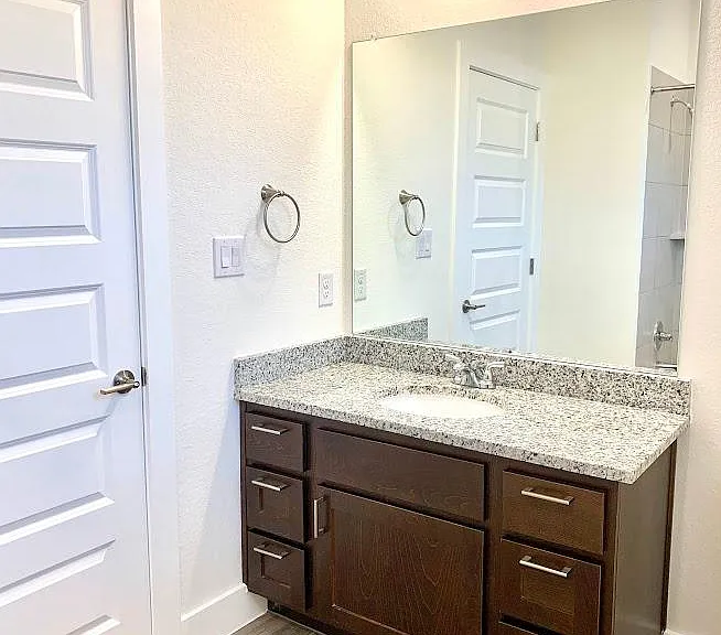 Second bathroom has granite countertops and full tub/shower combo.