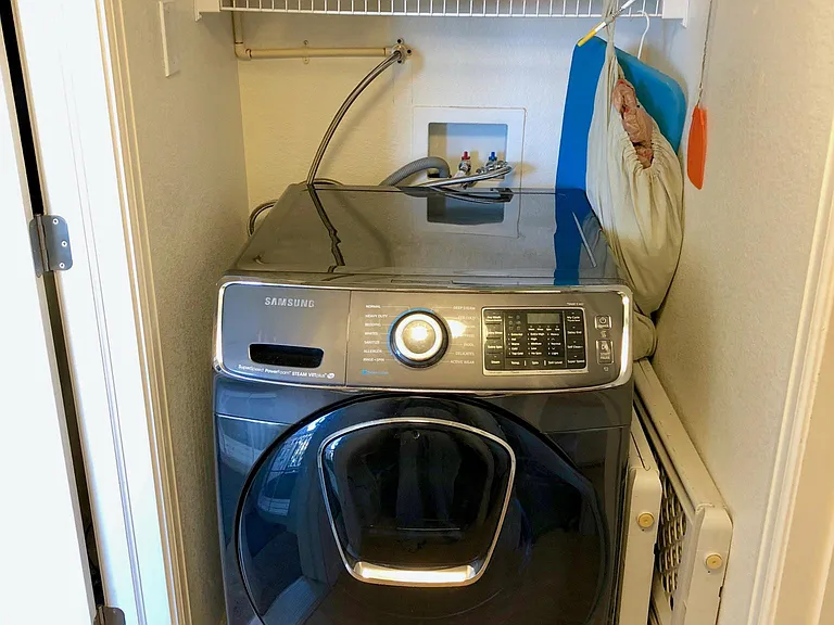 Included washer with storage above