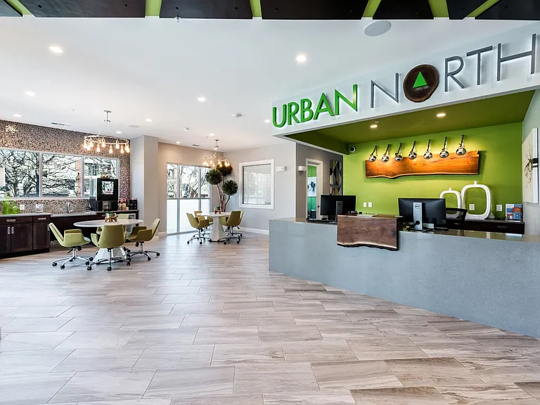 Leasing office with large windows, leasing center, and cafe lounge