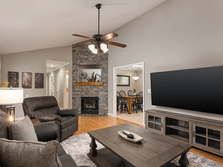 Half vaulted ceiling in living room with gas fireplace