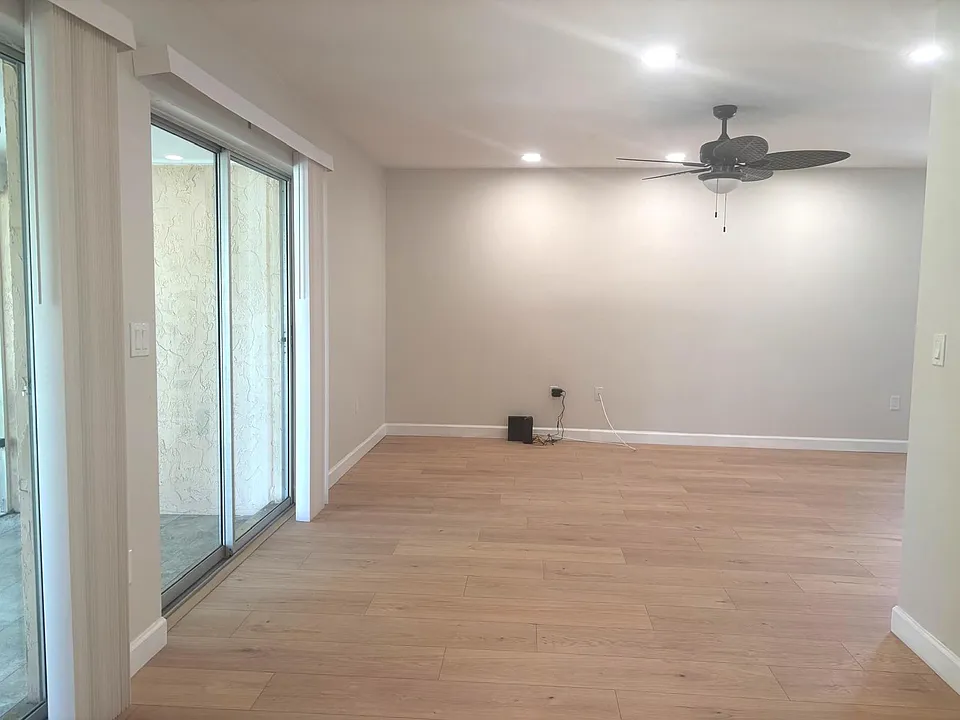 Spacious dining area and living room with access to the lanai