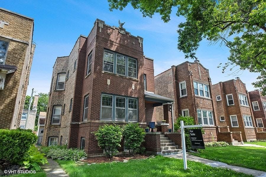 Well maintained brick Two flat on residential, tree lined street.
