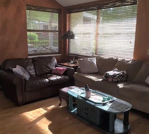 Family room with wood flooring