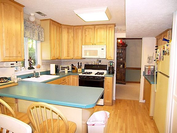 42” Cabinets and nearly new gas range, dishwasher and built in microwave.