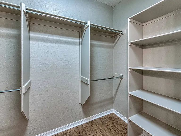 Built-in shelves extra storage in closet area.
