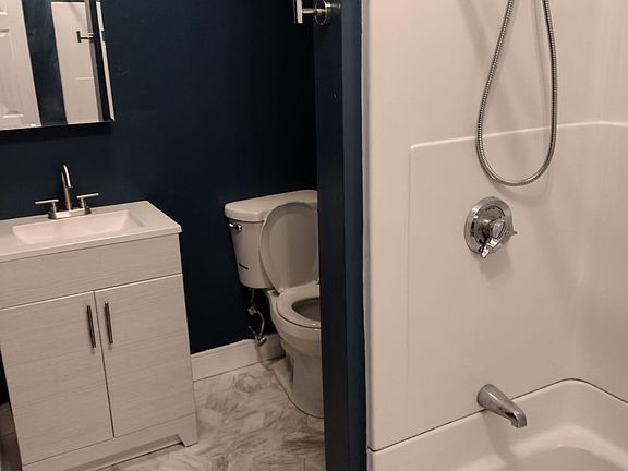New vanity and medicine cabinet with new tiled floor