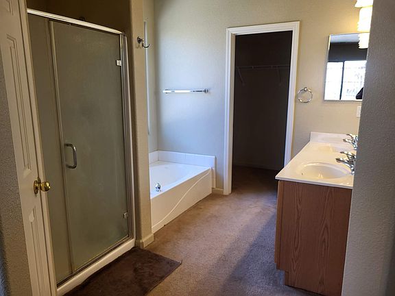 Master bath, dual sinks, separate shower tub and toilet room. Walk in closet.