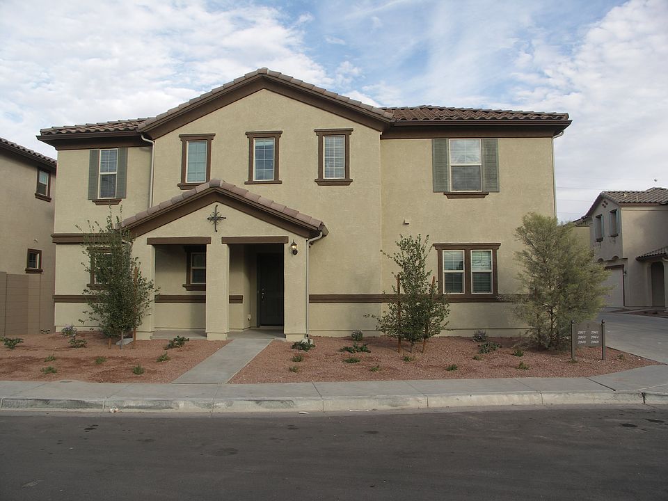 The front elevation and entryway of the home