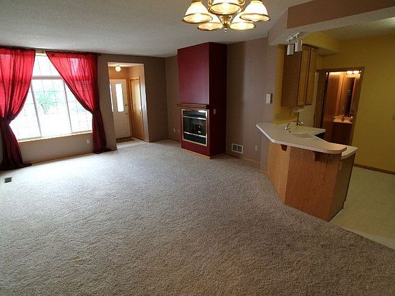 View facing through living room out to patio.
