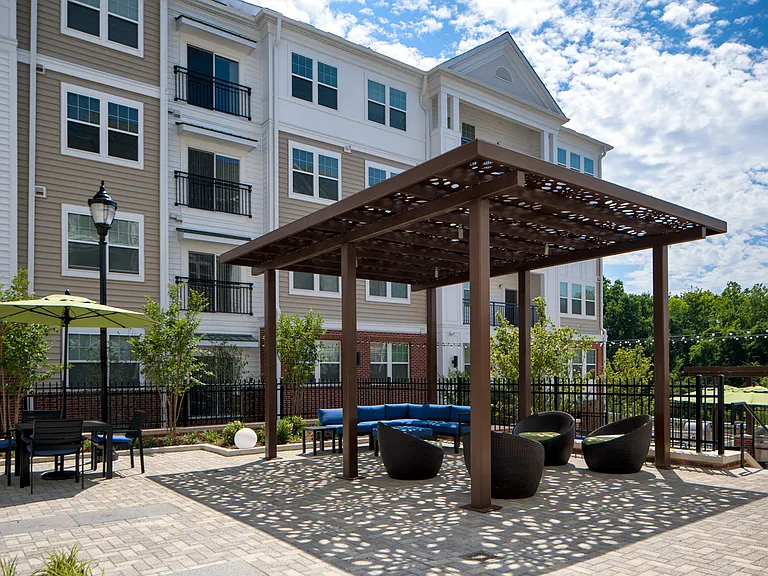 Courtyard for outdoor living, offering gorgeous water feature, cabana, pergola lounge area and grilling station